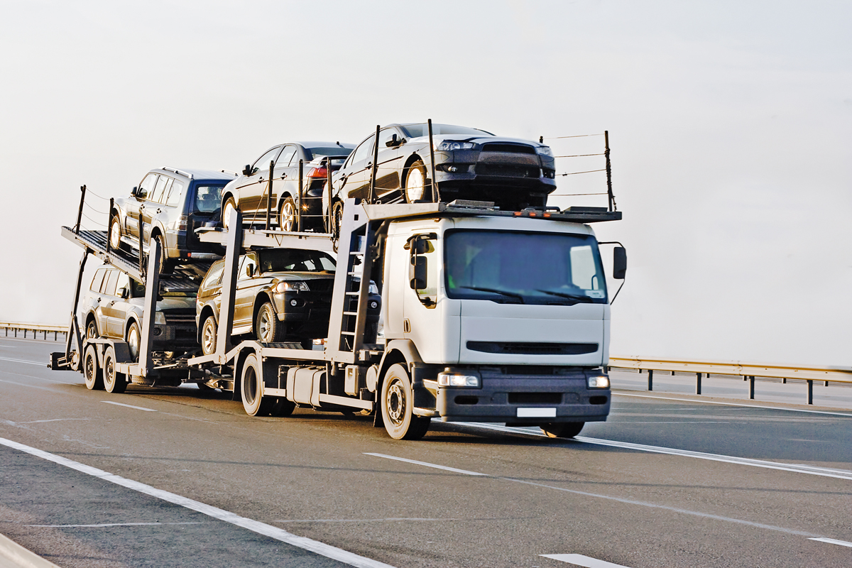 Photo of a car carrier for article: A comprehensive guide to stree-free car shipping.