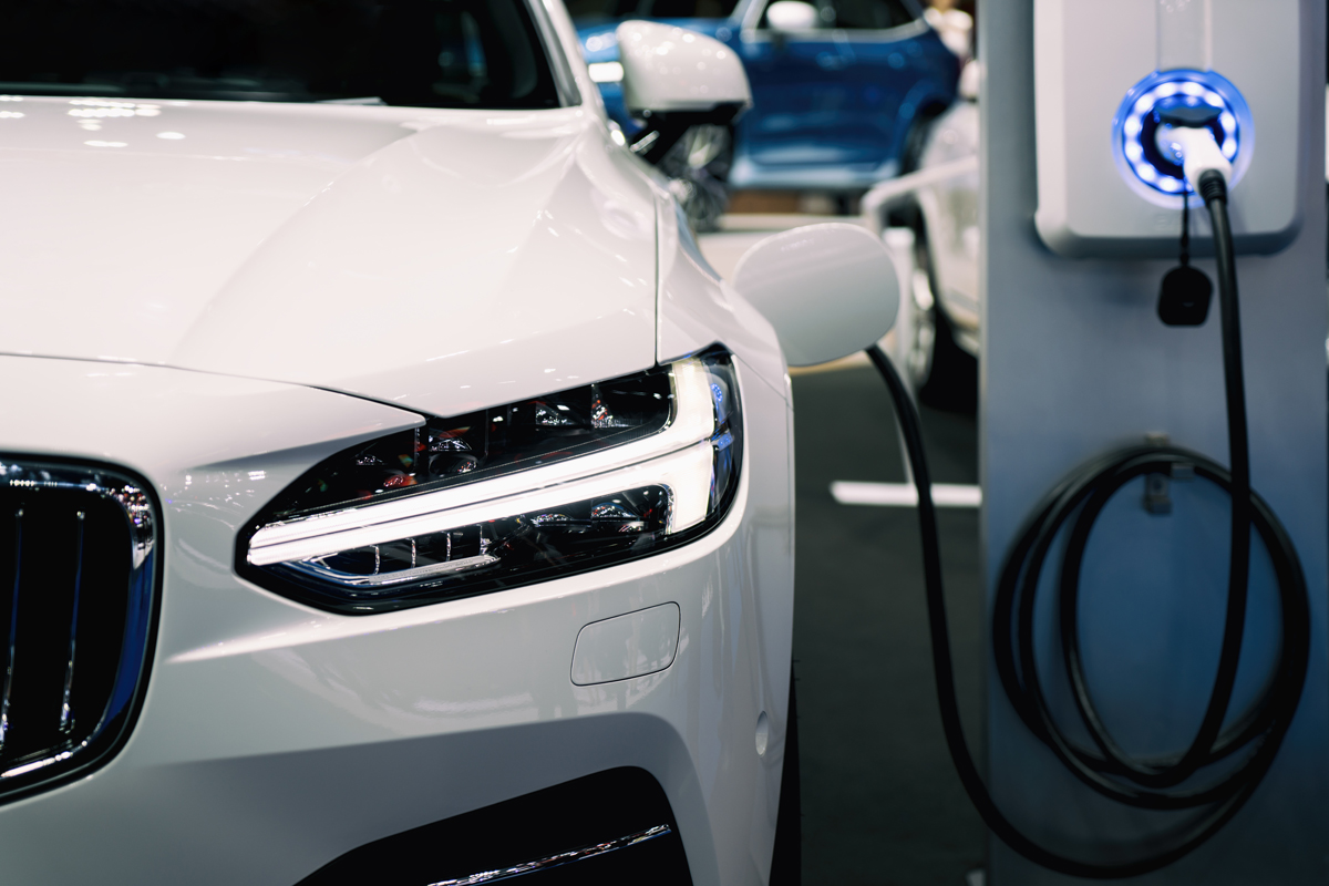 Car shipping for electric vehicles - photo of a hybrid electric vehicle being charged and prepared for shipping.