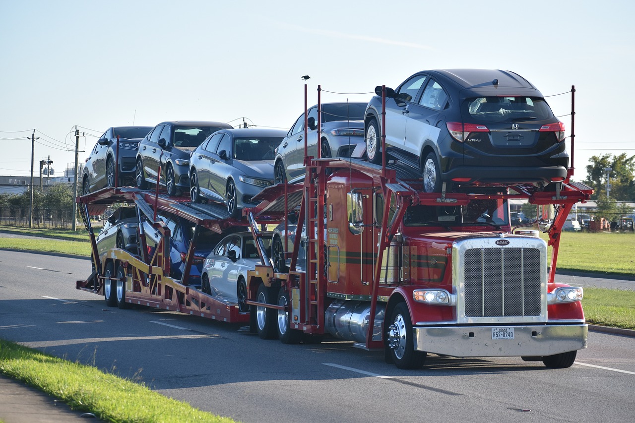 Photo of a car carrier truck with Top Load.