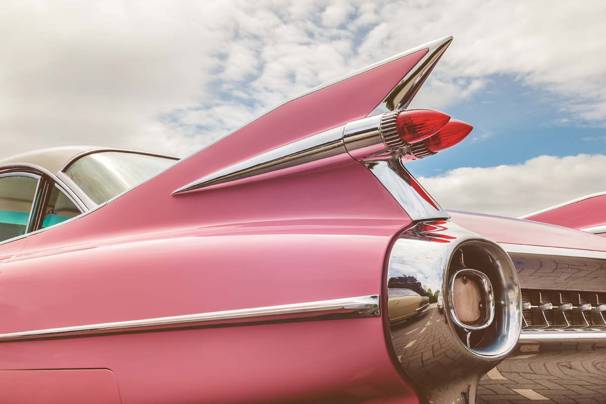 Non running classic car shipping for a pink cadillac.